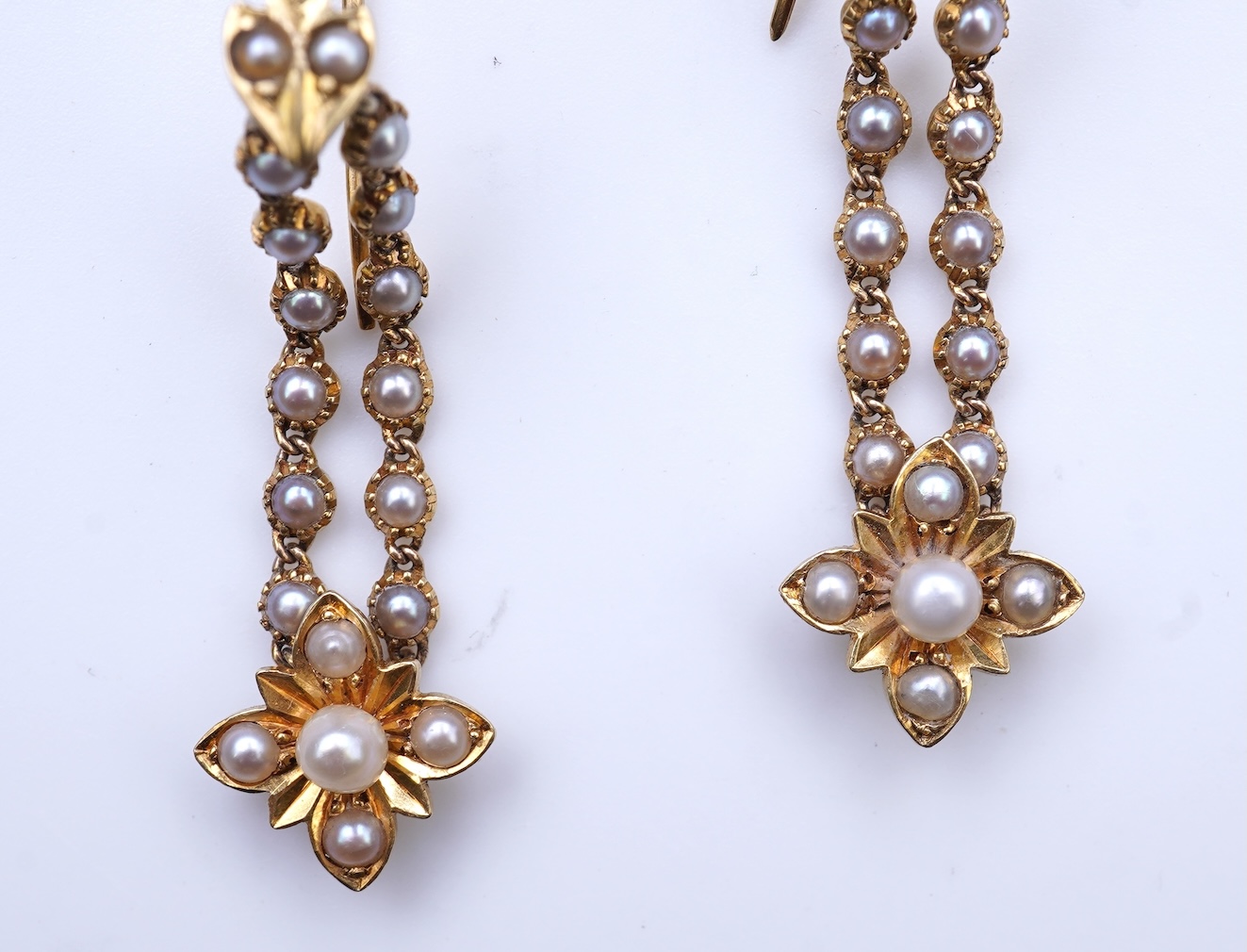 A pair of Edwardian seed pearl earrings, early 20th century composite